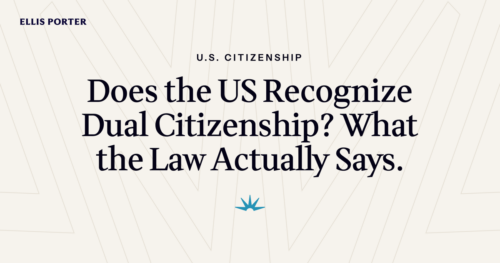 Person holding two passports while reviewing US dual citizenship rules.