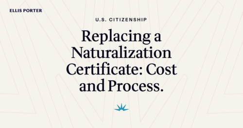 A new U.S. citizen holding a Certificate of Naturalization document.